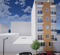 A building in Torrevieja on Campoamor Street 12, with cars parked next to it.