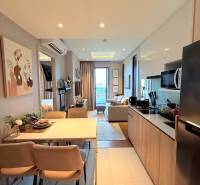 Kitchen and dining area in a 3-room apartment with comfortable seating and a view.