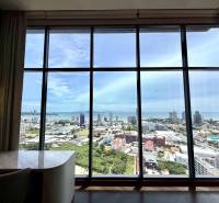 View from a 4-room apartment of the Pattaya city skyline and coastline.