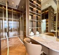 Luxury room with mirrored walls in a 4-room apartment, elegant wooden floor pattern.