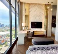 A stylish 4-room apartment interior with a view of the city skyline, elegant furnishings.