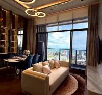 Living room in a 4-room apartment with a view of the city and the sea.