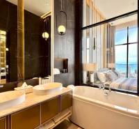 Luxury bathroom in a 4-room apartment with a view of the sea from the bed.