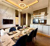 Dining table and living room in a 4-room apartment with a modern interior.