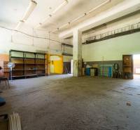 Warehouses and halls with old furniture and storage shelves.