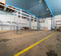 Empty shelves and storage spaces in manufacturing facilities.