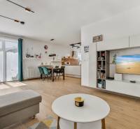 Living room with kitchen in a family house, bright, spacious, with comfortable furniture and a television.