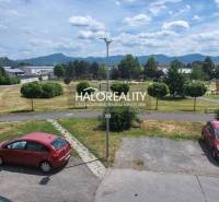 Parking lot and greenery with a view of the mountains in Žiar nad Hronom.