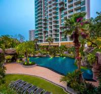 Apartment construction in Pattaya, with a swimming pool and tropical garden.