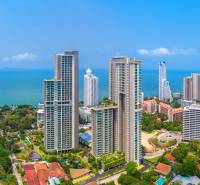 Apartment construction in Pattaya, high-rise buildings by the coast with a sea view.