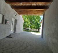 The passage between the buildings of a family house in Trakovice, a paved area leading to the yard.
