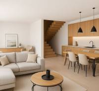 Living room with kitchen and wooden furniture in a family house.