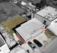 Aerial view of a family house in Trnové near Žilina with parked cars.