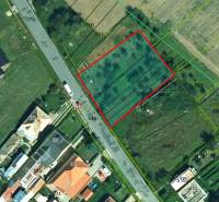 Aerial view of Land - commercial in Kamenné Kosihy, outlined in red.