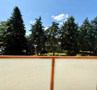 Balcony with a view of trees and greenery on Hollého Street, Senica.