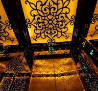 Interior of an elevator with ornamental decoration in residential construction.