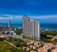 Construction of apartments in Pattaya by the coast with sea views and surrounding greenery.