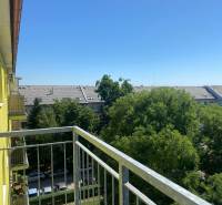 View from the balcony of a 3-room apartment on Na úvrati street in Bratislava, tree greenery.