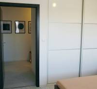 Interior of a 3-room apartment with a white built-in wardrobe and wall decorations.