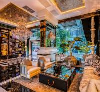 Luxurious living room with crystal chandeliers and comfortable seating, Apartment construction.