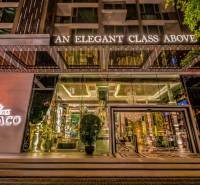 Entrance to the Apartment Complex with a lit sign in Pattaya, luxuriously furnished interior.