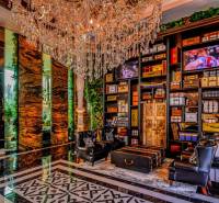 Luxury interior with a crystal chandelier and decorative elements in the context of apartment construction.