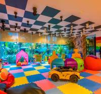 Colorful children's playroom with toys and play area. Apartment construction.
