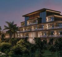A view of a multi-story family house with palm trees on Nungwi Street in Zanzibar North.