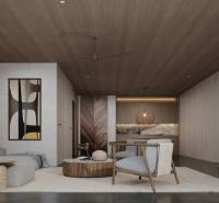 Interior of a family house with a sofa, armchairs, and artwork on the wall.