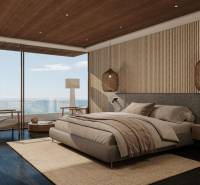 A bedroom in a family house with large windows, a wooden ceiling, and elegant furniture.