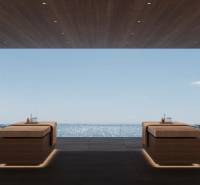 Interior with ocean view, two massage tables, and the sign 