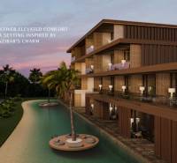 A family house in Nungwi, Zanzibar North, surrounded by tropical palm trees and an artificial water feature.