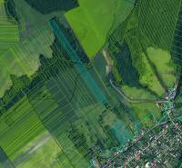 Aerial view of agricultural and forest lands around Ladomirová.