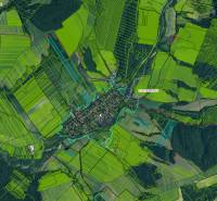 Aerial view of agricultural and forest lands in Ladomirová with parcel layout.