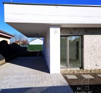 A family house in Turany with a spacious yard and glass doors.