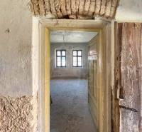 An old arched passage in the interior of a family house with original brickwork decoration.