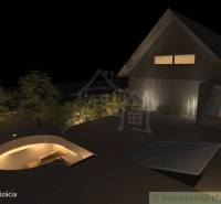 Night visualization of a family house in Banská Bystrica with lighting and an outdoor area.