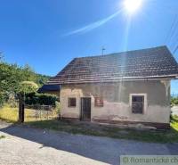 A family house near Banská Bystrica with a traditional roof and a rural setting.