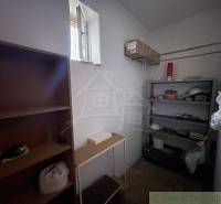 Storage space with shelves in a family house, suitable for storing items.
