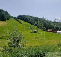 A ski slope surrounded by forests in Stará Myjava during the summer season.