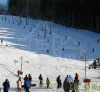 A ski slope in Stará Myjava with many skiers and a ski lift.