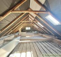 The attic of a family house with wooden beams and roof windows in Spišská Nová Ves.