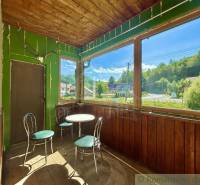 A glass-enclosed veranda in a family house with a view of the surroundings of Spišská Nová Ves.