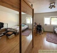 Bright room with space for sleeping and working in a family house.