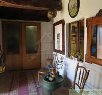 Traditional room with antique furniture, rustic atmosphere, decorations and mirrors, unique properties.