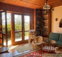 A cozy cottage interior with antique details and natural elements, ideal for Unique Properties.