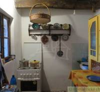 A kitchen in a rustic style with traditional elements and unique properties.