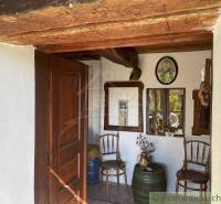 Entrance area of chalets, with wooden details and vintage decor, romantic cottages.