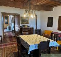 Rustic interior with a wooden ceiling, carpets, and antique furniture. Unique properties.