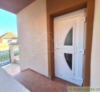 The entrance door to the family house in Komárno with a view of the street.